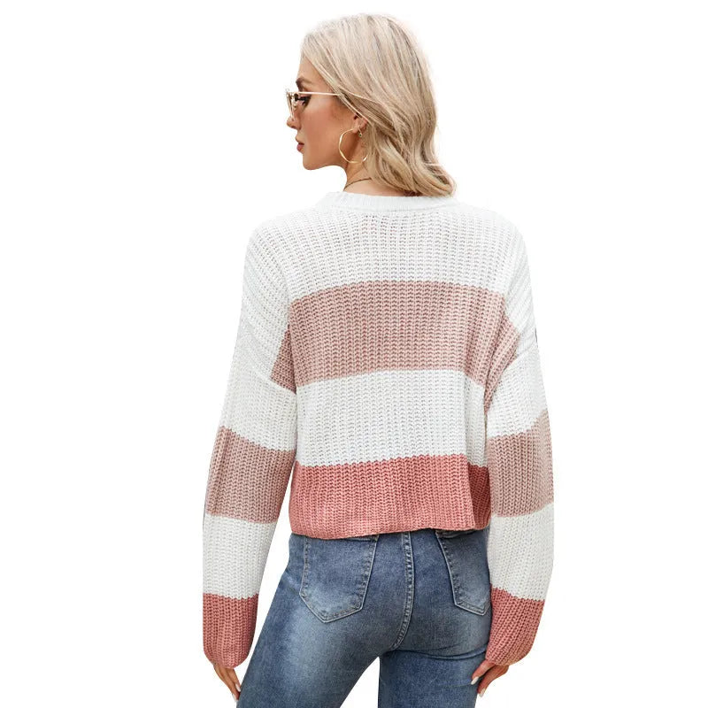 Women's short striped loose pullover in pink, dark blue or yellow on a hanger