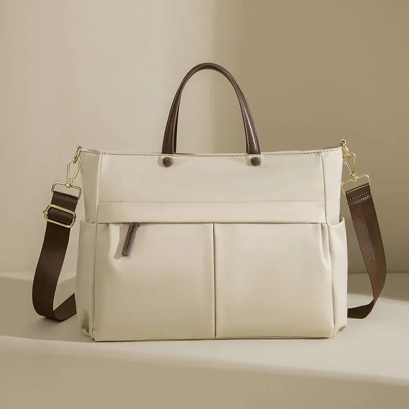 Women's Oxford cloth laptop briefcase in elegant black colour with open pockets and contrast stitching