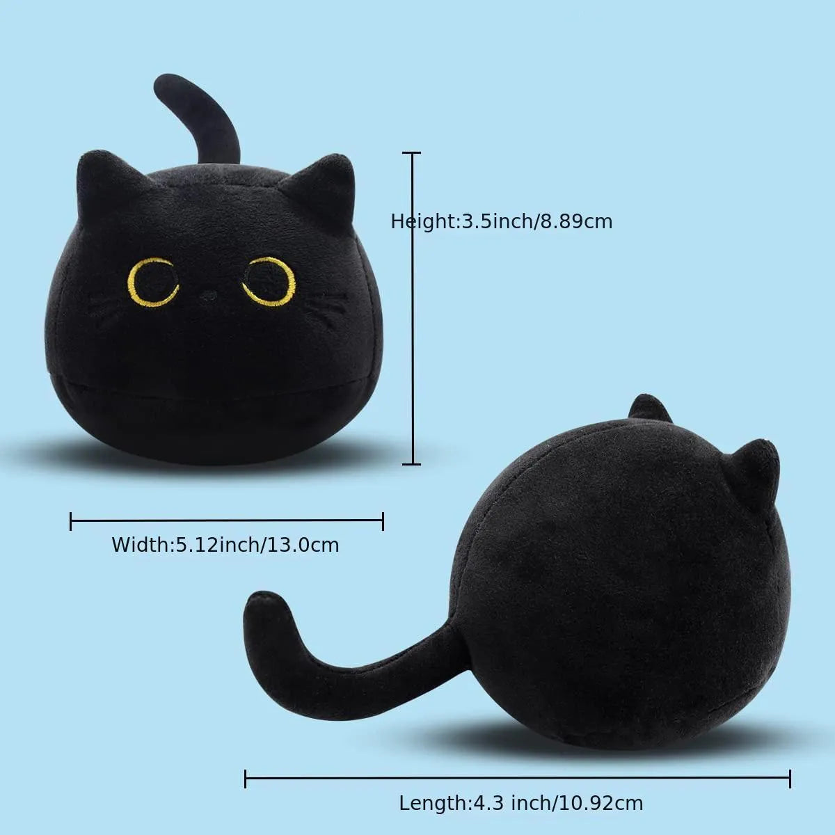 Fluffy black cat plush toy used as a soft pillow cushion on a sofa.