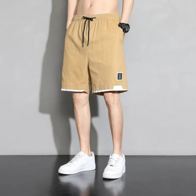 Boys cotton shorts in black, khaki and white colours showing mid waist design and shorts length
