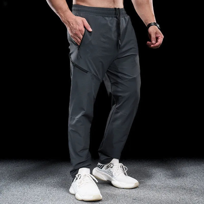 Men's waterproof quick-drying exercise pants in nylon fabric for sports and fitness activities