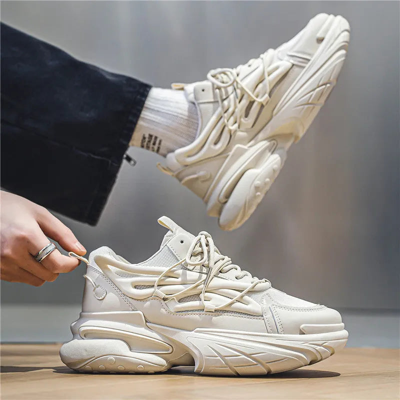 Men's low-top sneaker in beige with mesh PU leather upper and lace-up design on a rubber sole.