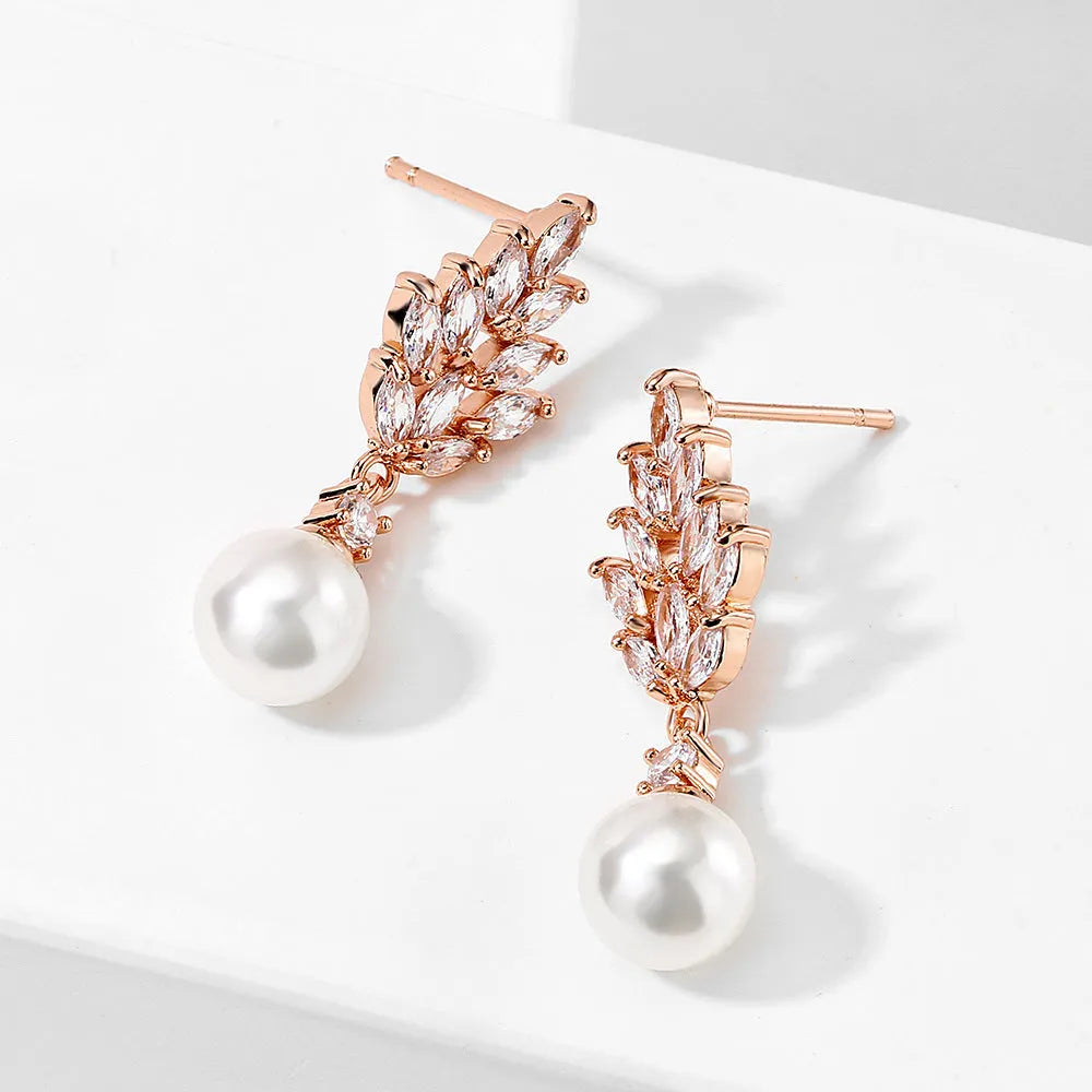 Geometric drop earrings with pearl and micro inlaid zircon, available in gold, platinum, and rose gold plating.