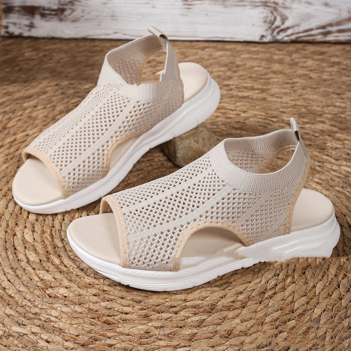 Women's platform sports sandals in black, milky white, and pink on a flat head design with a rubber sole.