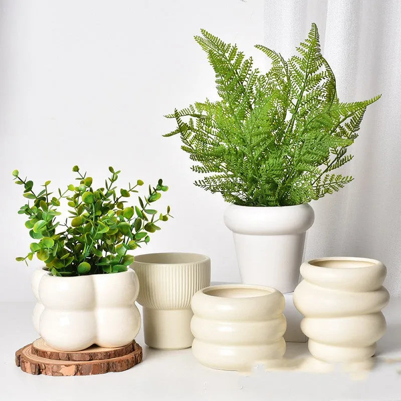 Roman column matte yellow ceramic flower pot with breathable, self-absorbent design.