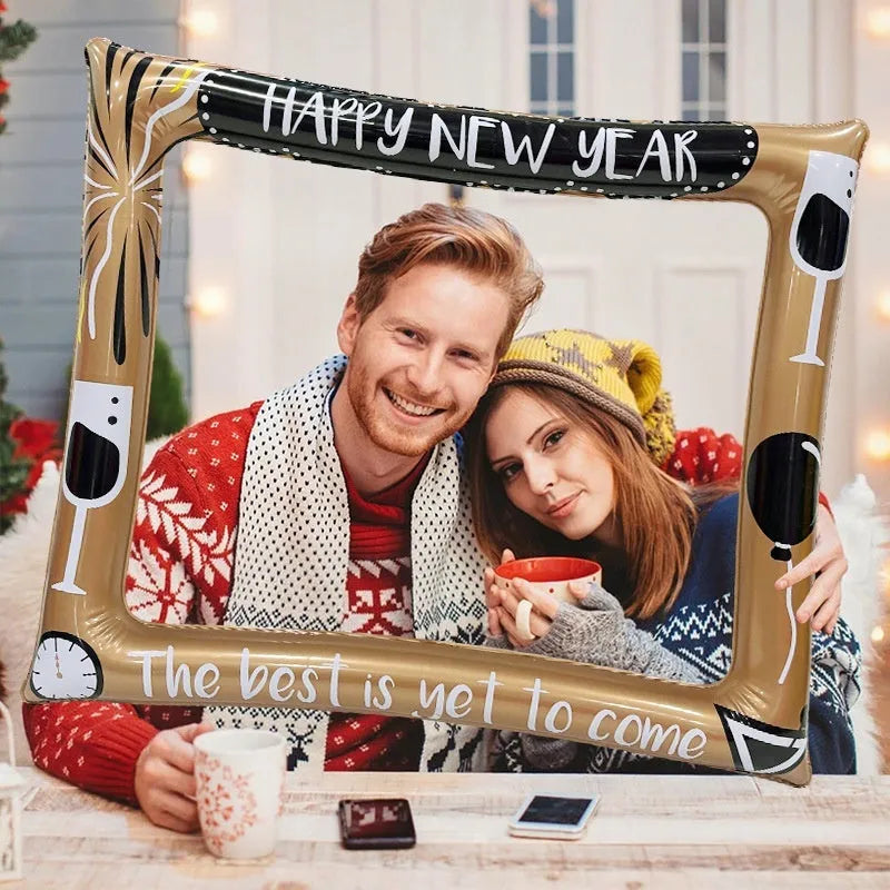 Red and white Christmas-themed inflatable photo frame made from PVC, shown as a party backdrop.