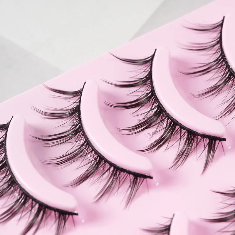 5 pairs of natural wispy manga false eyelashes on a black background, showing styles 007, 008, and 009 with plastic black terrier.