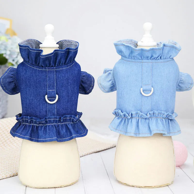 Blue denim pet dress with ruffles on the chest and a metal leash hook.