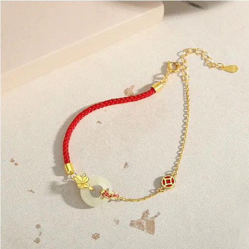 Gold electroplated Koi Peace Buckle Hetian Jade Red Rope Bracelet with safety clasp and animal zodiac design