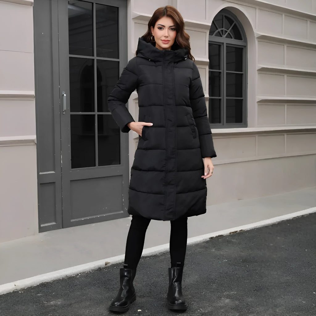 Black slim fit hooded jacket with long sleeves on a hanger.