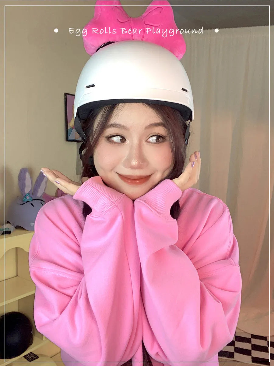 Soft plush bow helmet decoration with pom-pom in red, pink, and peach colour options.