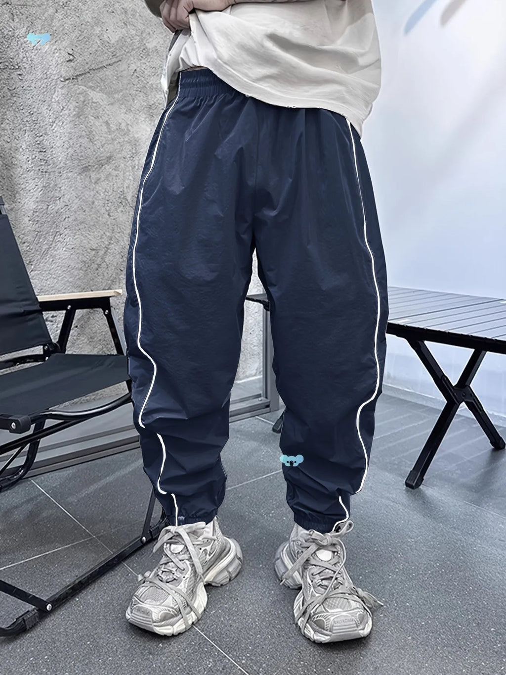 Men's loose fit cropped sports trousers in bamboo fibre, shown in khaki colour.