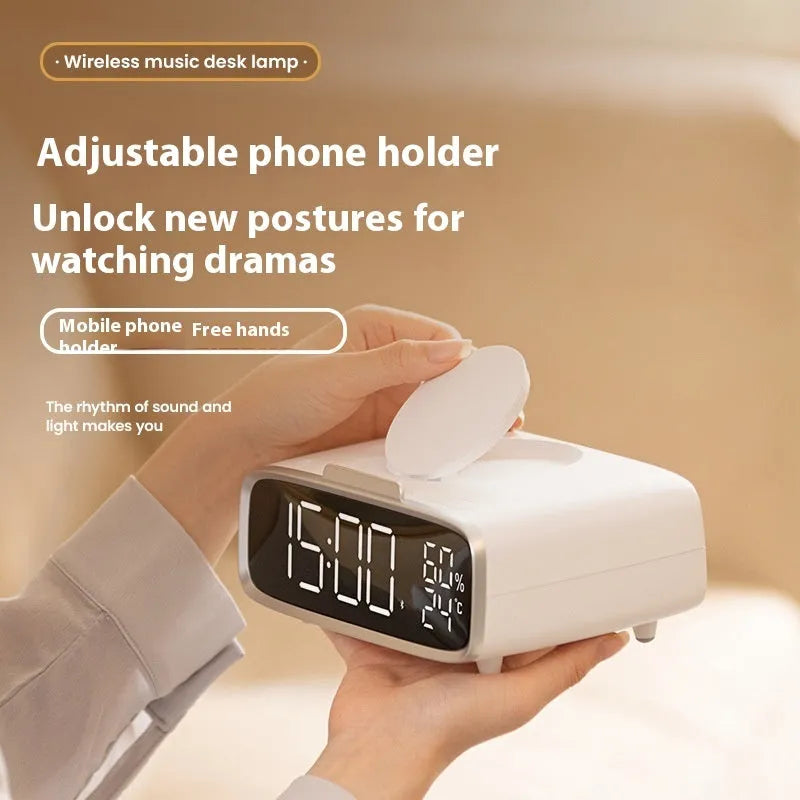 White wireless charging stand with built-in Bluetooth speaker and night light on bedside table