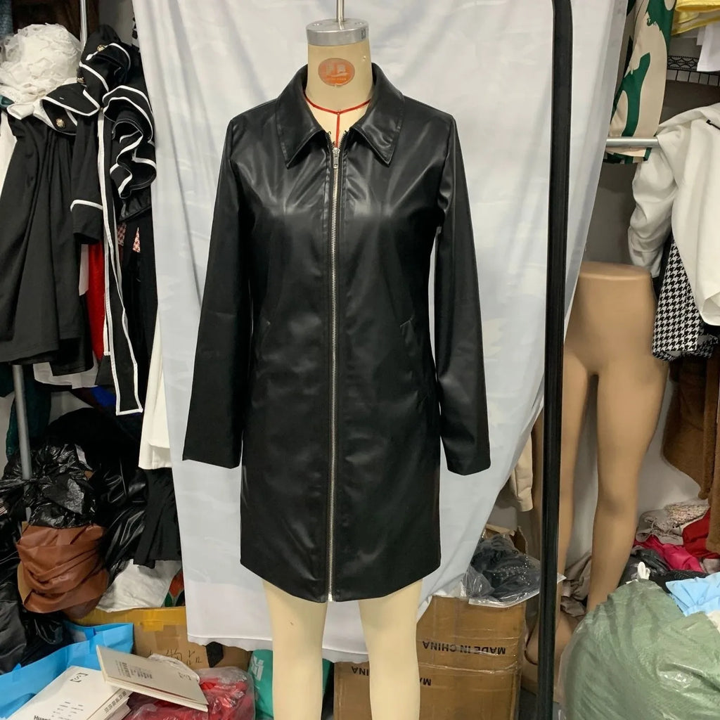 Black women's leather-style jacket medium length with long sleeves on hanger