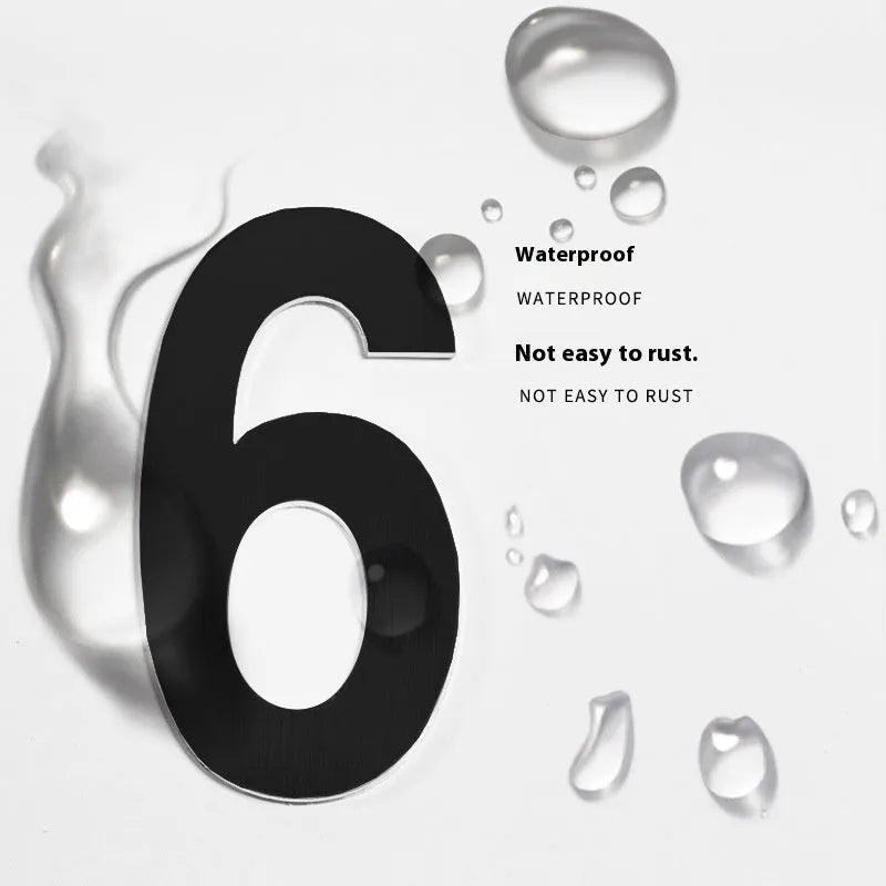 Black stainless steel self-adhesive house number sign showing the digit 7, 7.5cm tall.