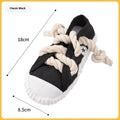 Plastic slipper-shaped dog chew toy with squeaker in yellow, black, or blue.