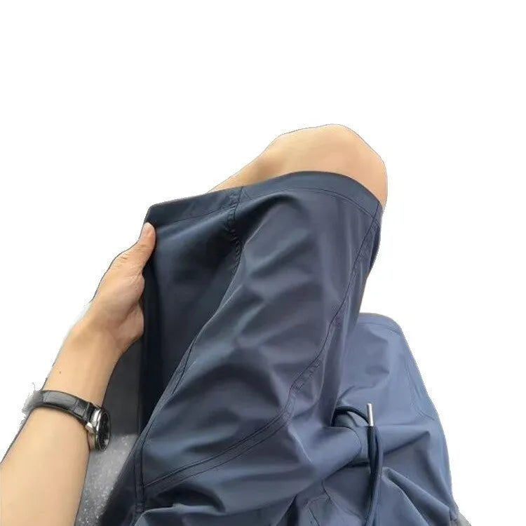Men's slant cut quick-drying sports shorts in polyester fabric available in three colours