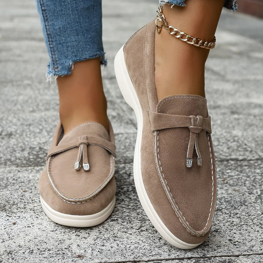 Men's apricot canvas slip-on loafers with a platform sole and round toe on a neutral background.