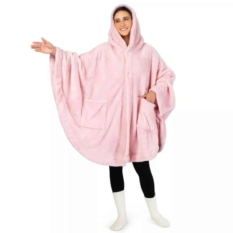 A thick pink hooded cloak bathrobe with long sleeves, shown on a hanger.