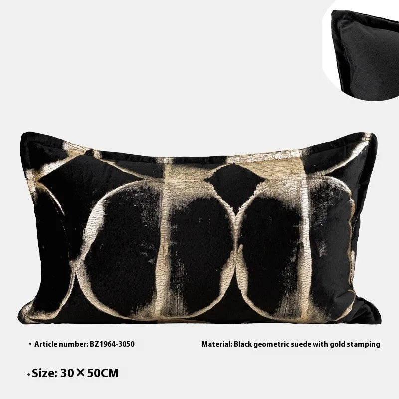 Black gold abstract pattern decorative cushion with removable cover in three size options on a sofa.