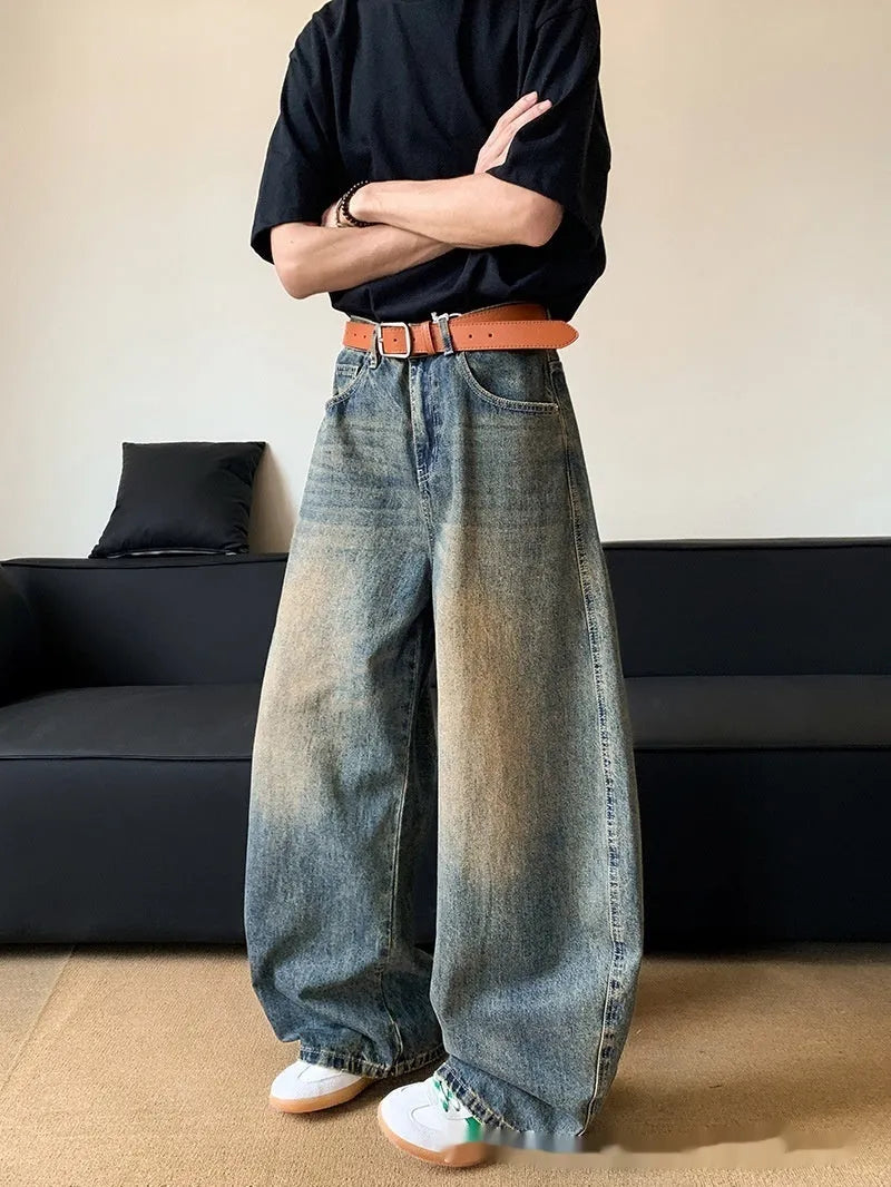 Men's retro blue distressed denim jeans with slim wide-leg cut and micro stretch fabric