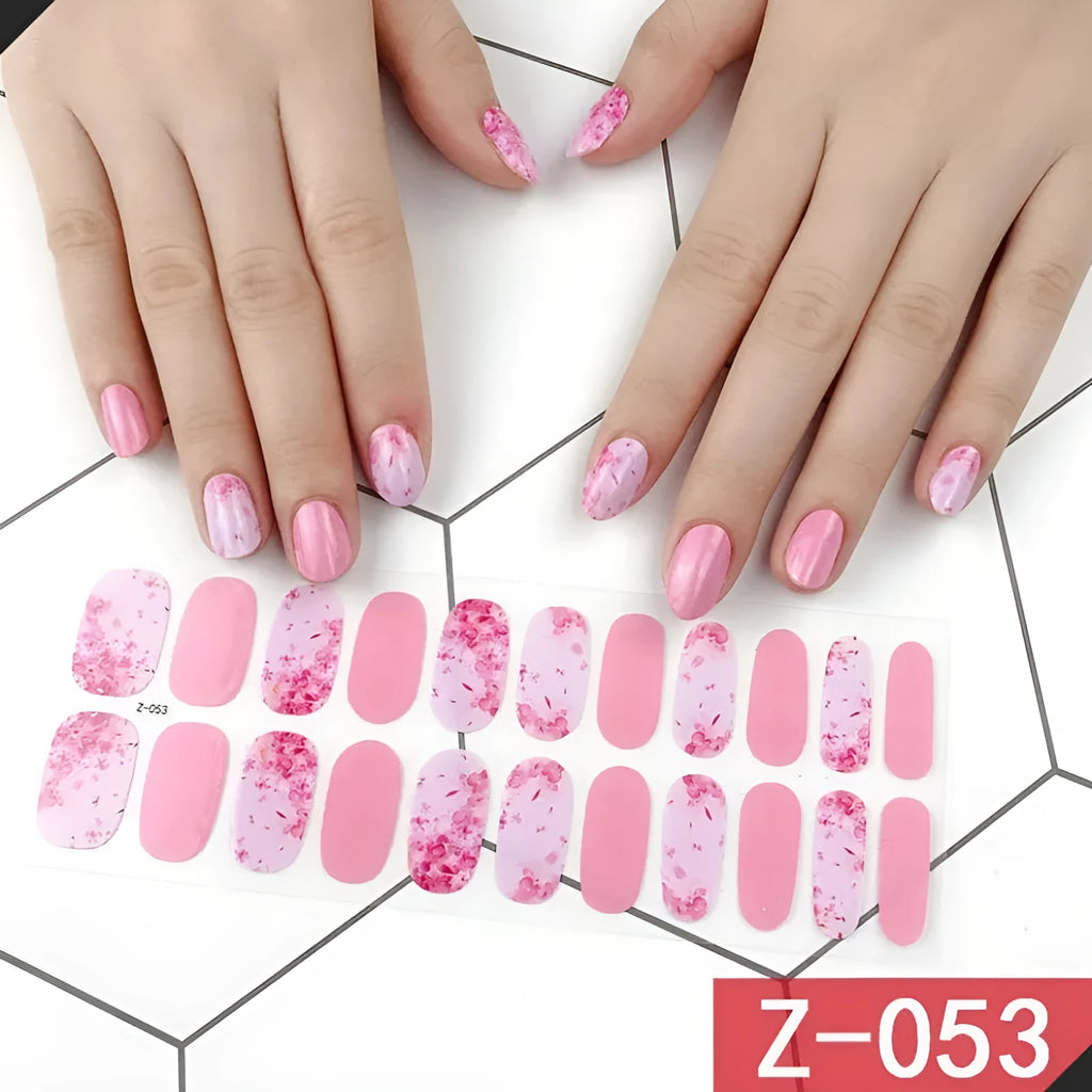 Korean nail art sticker sheets showing cartoon, floral, strawberry and bow designs with a nail file.
