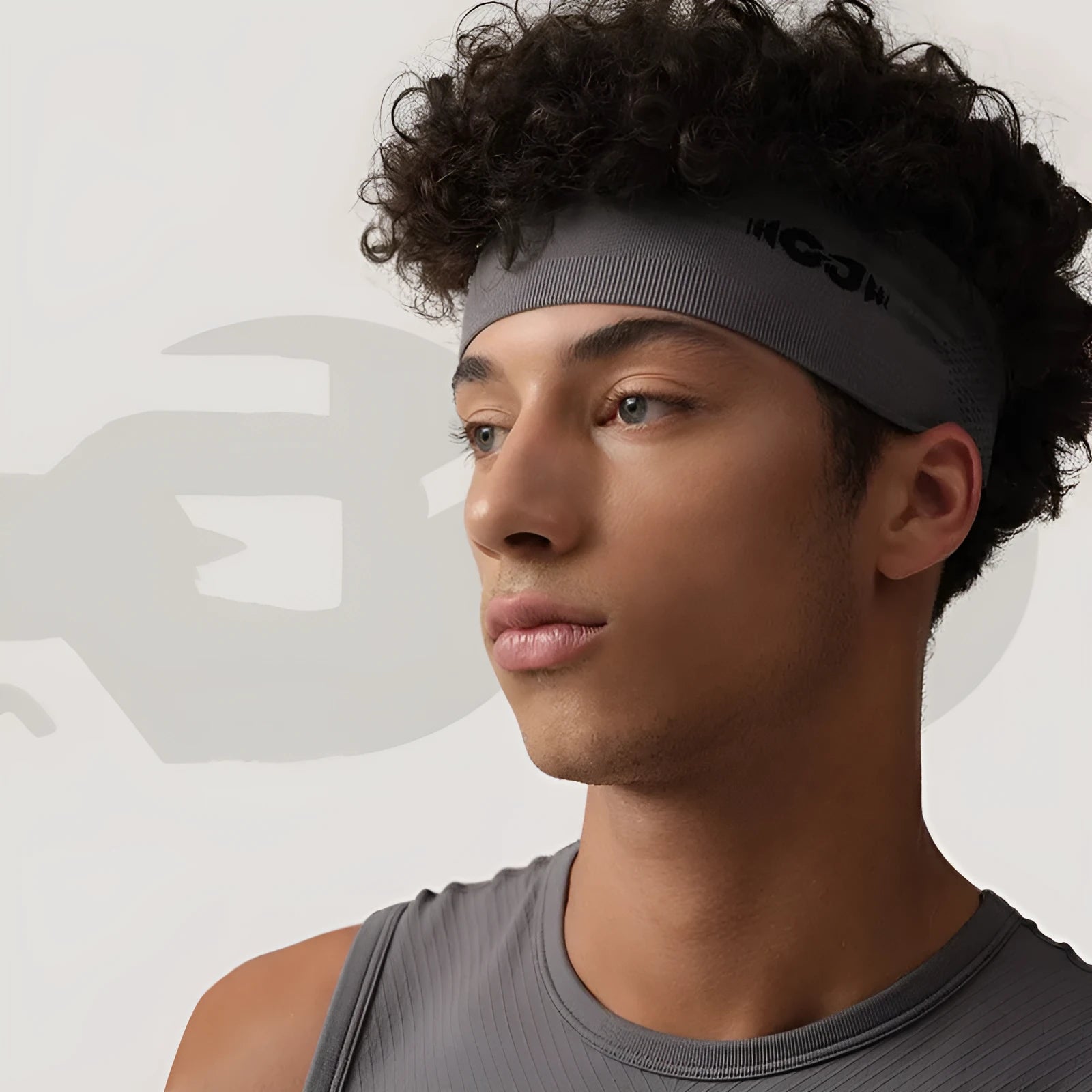 Seamless knitted exercise hair band in classic black, carbon grey, and purplish blue colours for sports use