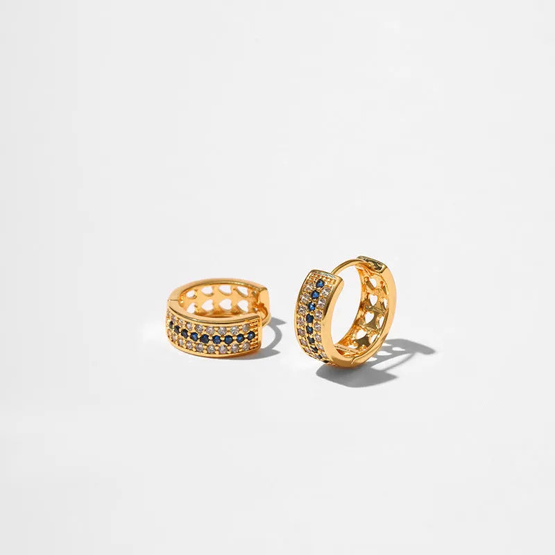 Round geometric women's earrings with copper construction and 18K gold electroplated finish.