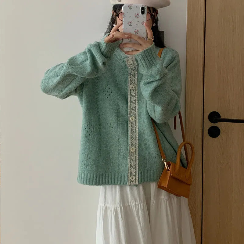 Loose-fit retro style cardigan coat in viscose knit, shown in apricot colour.