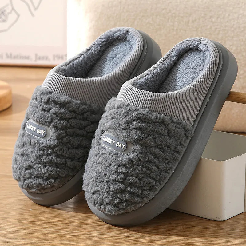 Men's grey and brown plaid winter slippers with rabbit hair upper and thick sole.