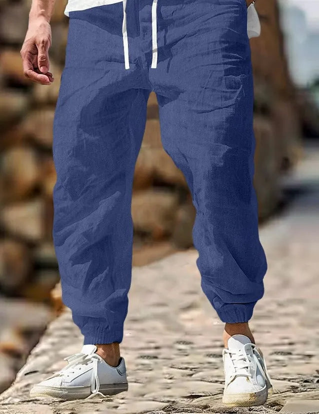 Men's straight-cut cotton trousers with elastic waist in army green colour.