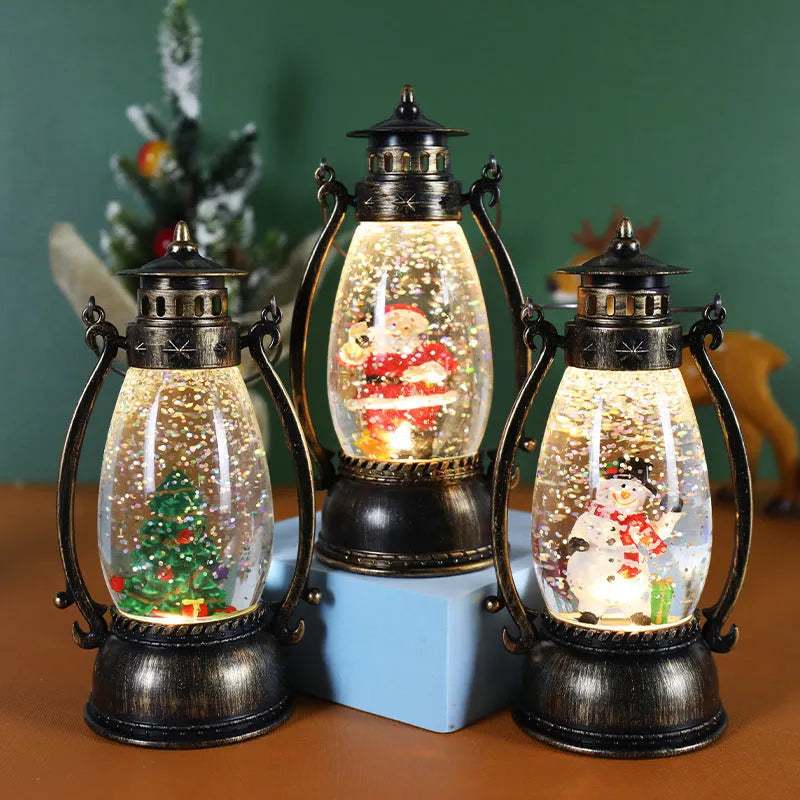 Clear plastic crystal ball oil lamp with LED light, showing snowman and elderly figure design options.