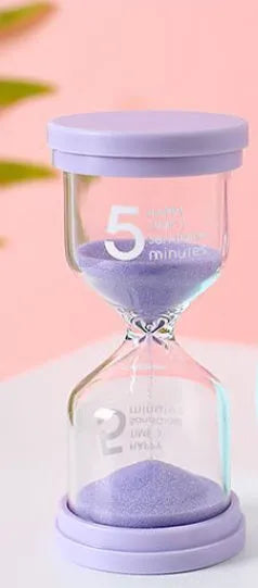 Handmade glass sand clock timer showing sand flow with modern simplicity design