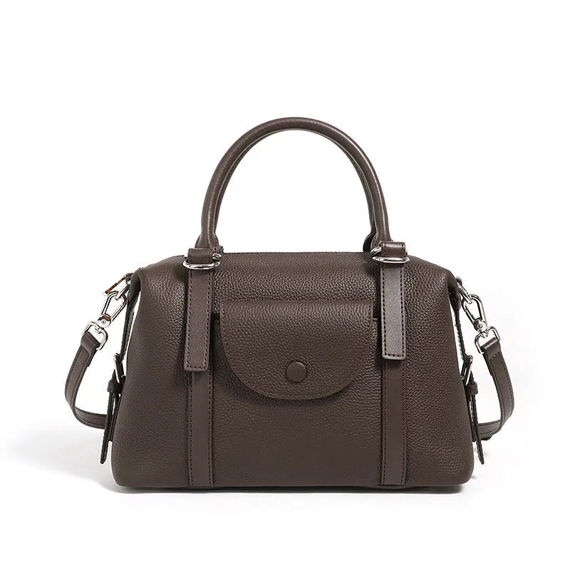 Genuine leather ladies shoulder bag in street trend style with lock detail and contrast stitching.