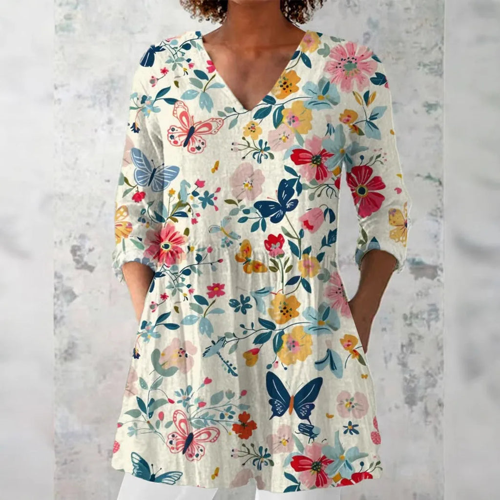 Women's retro slim fit printed long-sleeved polyester top on a hanger, showing digital print detail.