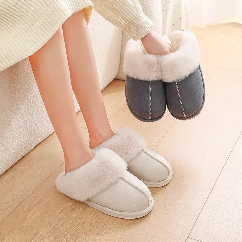 Women's plush-lined indoor slippers with round toe and flat heel in a choice of colours.