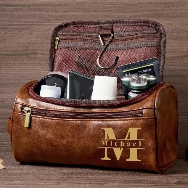 Men's black PU leather travel toiletry bag for grooming storage.