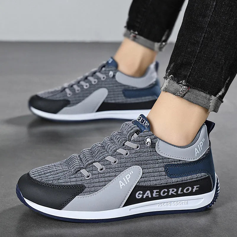 Men's grey and green mesh running shoes with round toe and lace-up closure shown in sizes 39-44