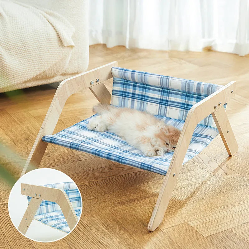 Elevated wood frame cat hammock bed with soft cloth covering in beach chair style design