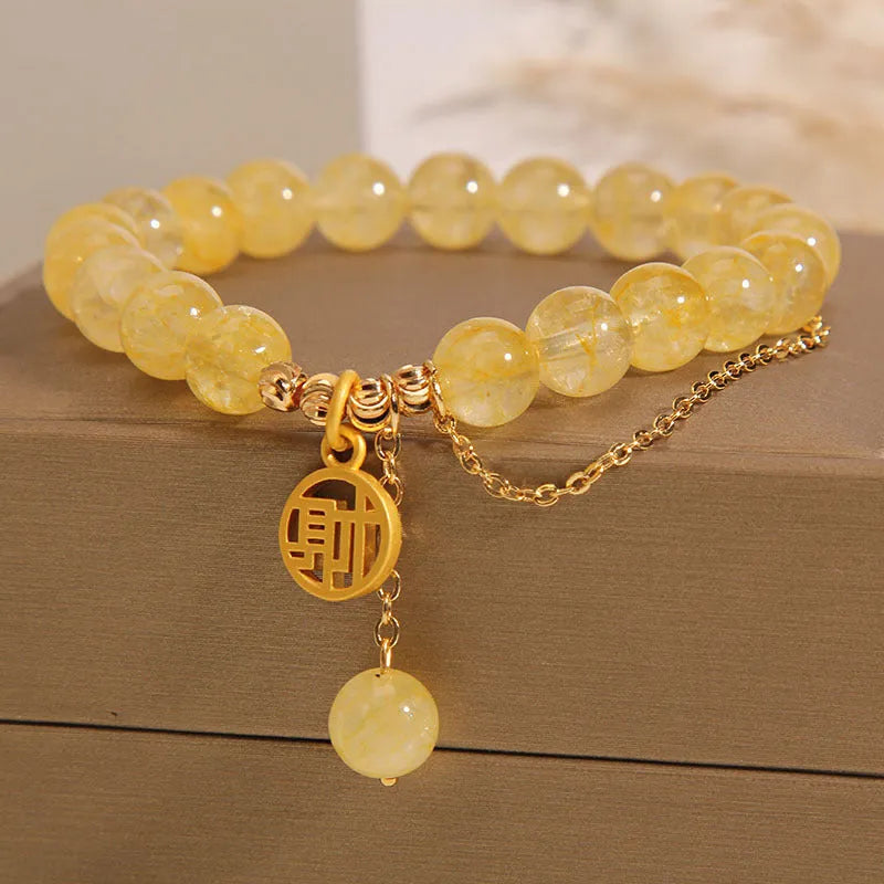Natural citrine bracelet with Chinese character tassel in gold electroplated finish