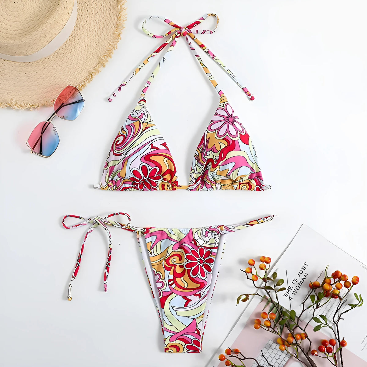 Women's multicolour triangle printed bikini with halter neck top and separate bottoms.