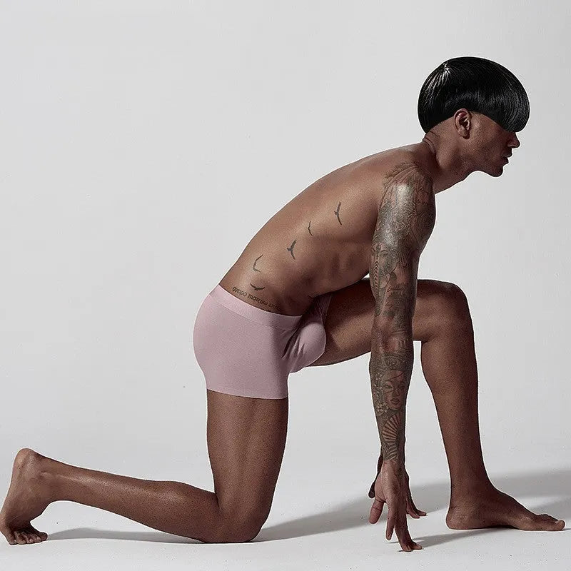 One-piece seamless modal men's underwear in a solid colour with a mid waist design.