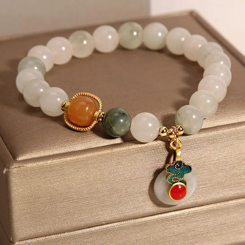 Ice jade bracelet for women with pearl charm and jade buckle in Chinese retro style.