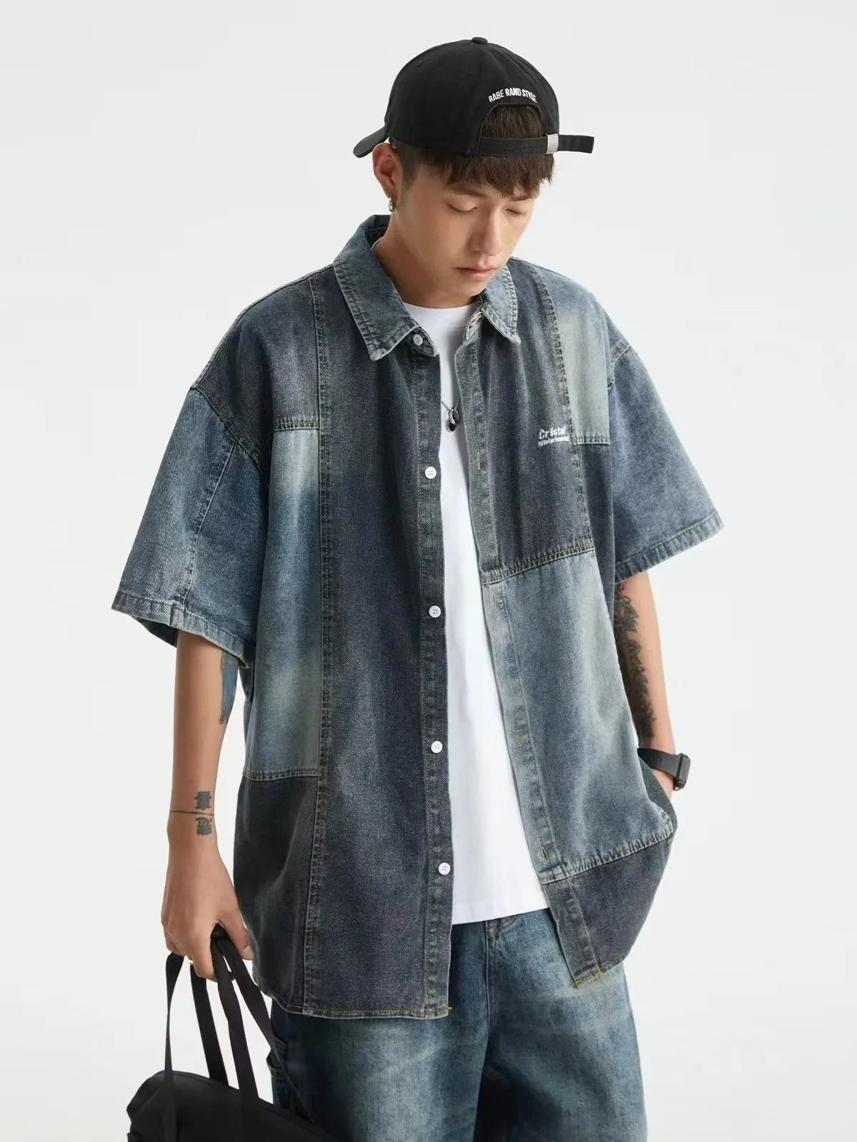 Blue loose-fit men's denim shirt cardigan with retro washed stitching on a hanger.