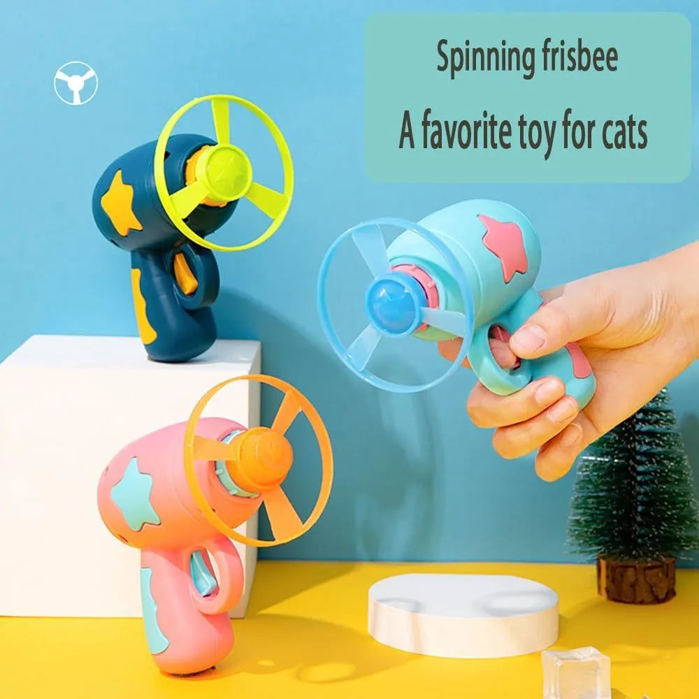 Blue interactive cat toy gun with spinning plastic frisbee for indoor cat chase play
