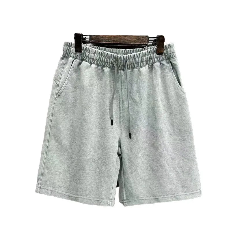 Men's cotton distressed shorts in straight leg cut with loose casual fit