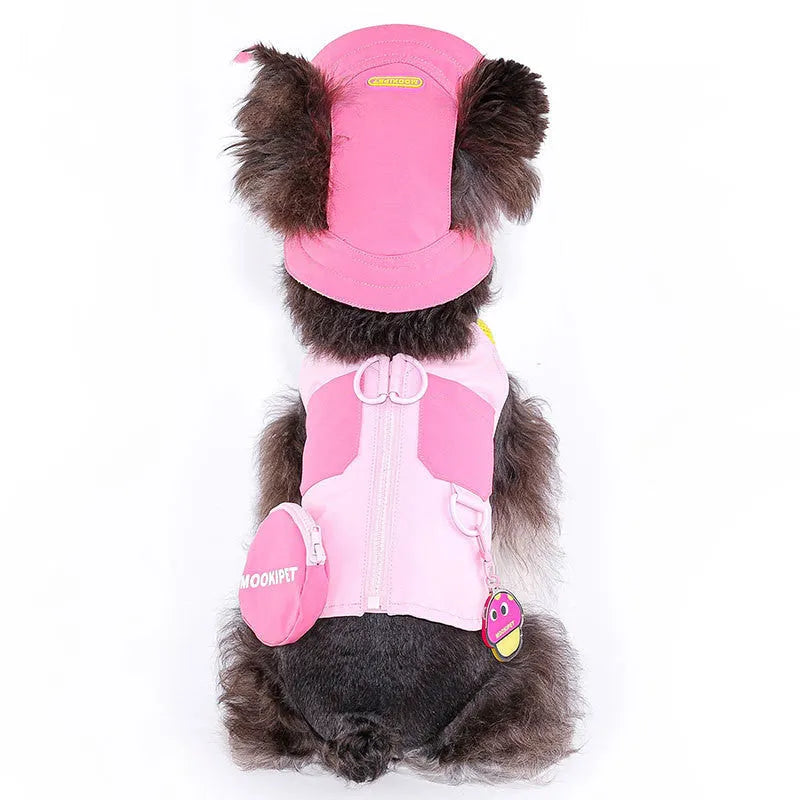 Pink polyester traction vest for a small white dog on a grey background.