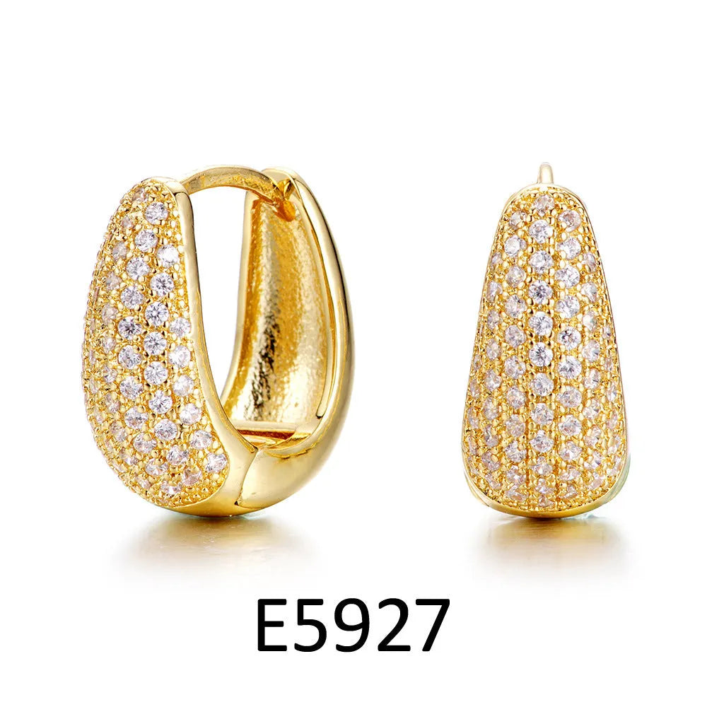 Gold-plated brass heart-shaped clip earrings with zircon stones and gang drill detailing