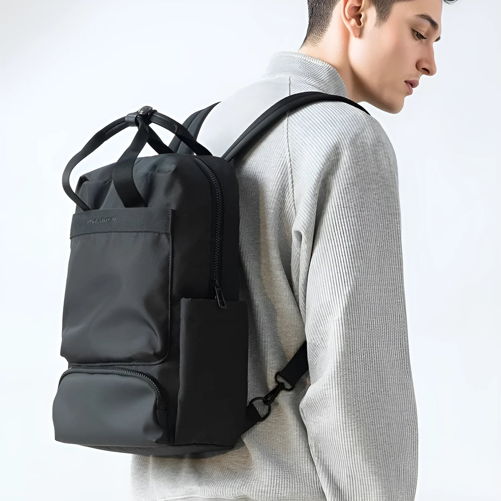 Elegant Black Oxford cloth computer backpack with a 20-35 litre capacity and polyester lining.