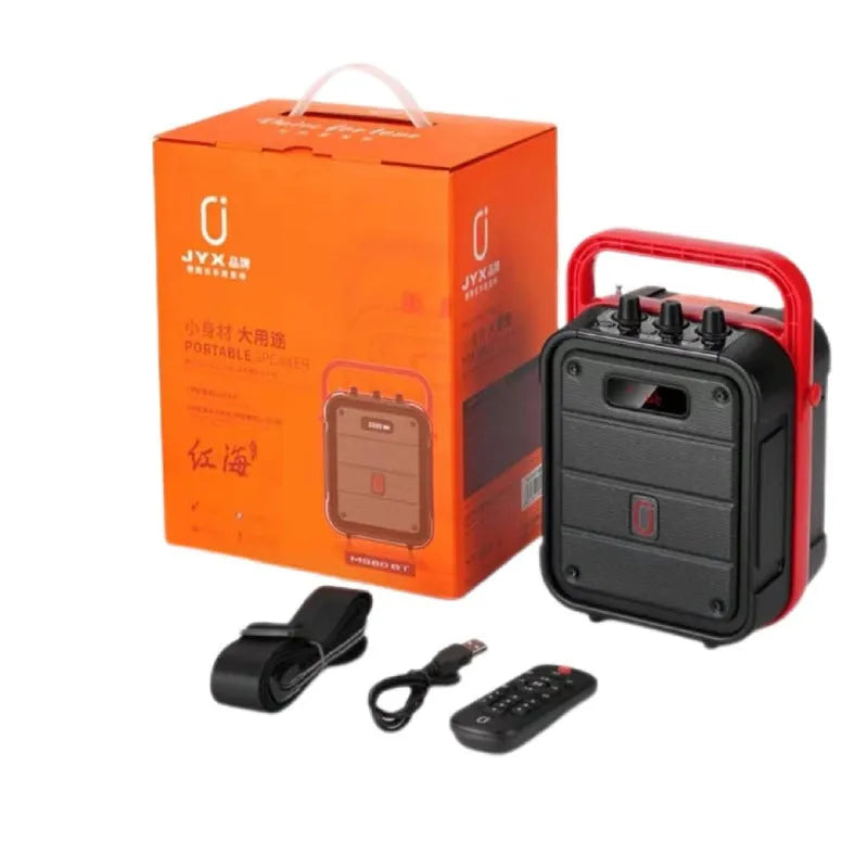 Portable MS62AI Bluetooth speaker with wireless microphone and remote control on a table